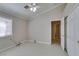 Neutral bedroom with light tile, a window, and a spacious closet at 259 Baring Cross St, Henderson, NV 89074