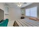 Bedroom with built-in display cases and a striped bed near the window at 259 Baring Cross St, Henderson, NV 89074