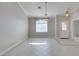 Bright dining area with tile flooring, chandelier, and a large window for natural light at 259 Baring Cross St, Henderson, NV 89074