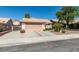 Charming single-story home featuring a well-maintained front yard and a two-car garage at 259 Baring Cross St, Henderson, NV 89074