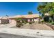 Landscaped front yard featuring desert landscaping and a charming single-story home with a two-car garage at 259 Baring Cross St, Henderson, NV 89074