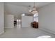 Spacious living room with tile floors, chandelier, and a piano in a naturally-lit room at 259 Baring Cross St, Henderson, NV 89074