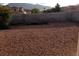 Large backyard with gravel landscaping, ideal for low-maintenance living and outdoor enjoyment at 266 Lyra Ln, Las Vegas, NV 89110