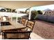 Outdoor living space with a patio table and chairs set, perfect for dining and relaxing at 266 Lyra Ln, Las Vegas, NV 89110