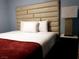 Bright bedroom features a large bed with an upholstered headboard and clean white bedding at 266 Lyra Ln, Las Vegas, NV 89110
