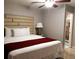 Bright bedroom featuring a large bed with soft white linens, and an open bathroom for easy access at 266 Lyra Ln, Las Vegas, NV 89110