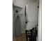Efficient laundry area with stacked washer and dryer, and an iron with its ironing board ready for use at 266 Lyra Ln, Las Vegas, NV 89110