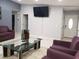 Spacious living room with stylish sofas, a modern glass coffee table, and ample natural light at 266 Lyra Ln, Las Vegas, NV 89110