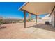 Spacious backyard with low maintenance xeriscape and covered patio at 2719 Frangipani Ct, North Las Vegas, NV 89031