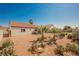 Private backyard with desert landscaping, mature plants, and a peaceful atmosphere at 2719 Frangipani Ct, North Las Vegas, NV 89031