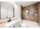 Bathroom featuring a vanity, soaking tub with decorative tile surround, and modern fixtures at 2719 Frangipani Ct, North Las Vegas, NV 89031
