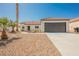 Charming single-story home with a well-maintained front yard and attached two car garage at 2719 Frangipani Ct, North Las Vegas, NV 89031