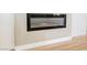 Close-up of an electric fireplace set into a gray painted wall with white trim at 2719 Frangipani Ct, North Las Vegas, NV 89031