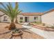 Charming single-story home with tile roof, desert landscaping, and a welcoming entrance at 2719 Frangipani Ct, North Las Vegas, NV 89031