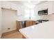 Bright kitchen featuring stainless steel appliances, white cabinets, and quartz countertops at 2719 Frangipani Ct, North Las Vegas, NV 89031