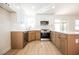 Updated kitchen boasts stainless steel appliances, modern cabinetry, and stylish countertops at 2719 Frangipani Ct, North Las Vegas, NV 89031