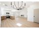 Spacious open layout with a modern chandelier and views of the remodeled kitchen at 2719 Frangipani Ct, North Las Vegas, NV 89031