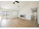 Bright living area showcasing luxury vinyl flooring and an electric fireplace at 2719 Frangipani Ct, North Las Vegas, NV 89031
