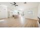 Open living area featuring luxury vinyl flooring, a modern fireplace, and a sliding glass door at 2719 Frangipani Ct, North Las Vegas, NV 89031