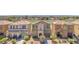 Aerial view showcases this community with ponds and nearby golf course, set against a distant city skyline at 2837 Canonero St, Las Vegas, NV 89142