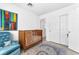 Charming bedroom with a crib, a rug, a chair, and a closet at 2837 Canonero St, Las Vegas, NV 89142