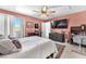 Spacious bedroom with a ceiling fan, rug, and a sliding glass door for natural light at 2837 Canonero St, Las Vegas, NV 89142