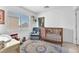 Bright Bedroom with a crib, comfortable chair, and colorful accents at 2837 Canonero St, Las Vegas, NV 89142