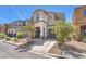 Charming two-story home features a welcoming entryway, attached garage, and well-maintained landscaping at 2837 Canonero St, Las Vegas, NV 89142