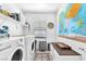 Organized laundry room featuring modern appliances and ample storage at 2837 Canonero St, Las Vegas, NV 89142