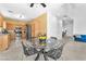 Open-concept living space combining the kitchen and dining areas, perfect for modern living at 2837 Canonero St, Las Vegas, NV 89142
