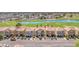 An eye-level street view showcasing charming homes near a picturesque pond and a lush green golf course at 2837 Canonero St, Las Vegas, NV 89142