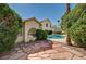 Backyard featuring a pool, desert landscaping and mature trees at 2917 Broken Willow Cir, Las Vegas, NV 89117