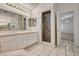 Bathroom featuring a stand up shower, double sink, and access to another room at 2917 Broken Willow Cir, Las Vegas, NV 89117