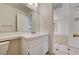 Cozy bathroom with tiled vanity and adjacent bedroom access at 2917 Broken Willow Cir, Las Vegas, NV 89117