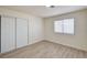Bedroom with a double door closet and bright window at 2917 Broken Willow Cir, Las Vegas, NV 89117