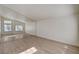 Bright bedroom featuring sleek light flooring, mirrors, and plenty of natural light at 2917 Broken Willow Cir, Las Vegas, NV 89117