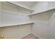 Walk in closet featuring built in shelving and neutral walls at 2917 Broken Willow Cir, Las Vegas, NV 89117