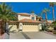 Charming home featuring a tile roof, desert landscaping, and an attached three car garage at 2917 Broken Willow Cir, Las Vegas, NV 89117