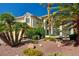 Charming home featuring a tile roof, desert landscaping, and an attached three car garage at 2917 Broken Willow Cir, Las Vegas, NV 89117