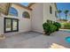 Exterior of home featuring stucco, patio, large arched windows, and desert landscaping at 2917 Broken Willow Cir, Las Vegas, NV 89117