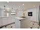 Spacious kitchen with island cooktop, white countertops and abundant cabinetry at 2917 Broken Willow Cir, Las Vegas, NV 89117