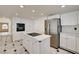 Open kitchen with a central island, stainless steel appliances, and white cabinetry at 2917 Broken Willow Cir, Las Vegas, NV 89117