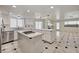 Updated kitchen with stainless appliances and a breakfast bar overlooking the living area at 2917 Broken Willow Cir, Las Vegas, NV 89117