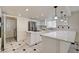 Updated kitchen featuring white cabinetry, stainless steel appliances, and a center island at 2917 Broken Willow Cir, Las Vegas, NV 89117