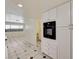 Kitchen view showcasing cabinetry and open access to living area at 2917 Broken Willow Cir, Las Vegas, NV 89117