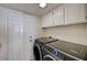 Laundry area with modern front-load washer and dryer at 2917 Broken Willow Cir, Las Vegas, NV 89117