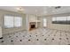 Spacious living room featuring a cozy fireplace and ample natural light at 2917 Broken Willow Cir, Las Vegas, NV 89117