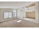 Bright living room featuring sleek light flooring, an open floorplan, and plenty of natural light at 2917 Broken Willow Cir, Las Vegas, NV 89117