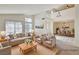 Bright, staged living room with vaulted ceilings and view to dining room, showcasing natural light at 2917 Broken Willow Cir, Las Vegas, NV 89117
