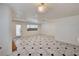 Bright and airy living room featuring tile floors and access to the kitchen at 2917 Broken Willow Cir, Las Vegas, NV 89117